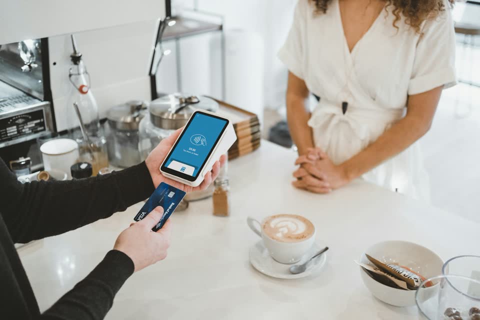A card terminal on a café counter