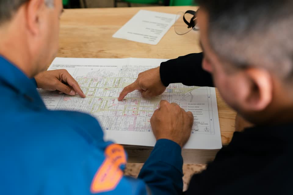 Two colleagues going over a printed document together